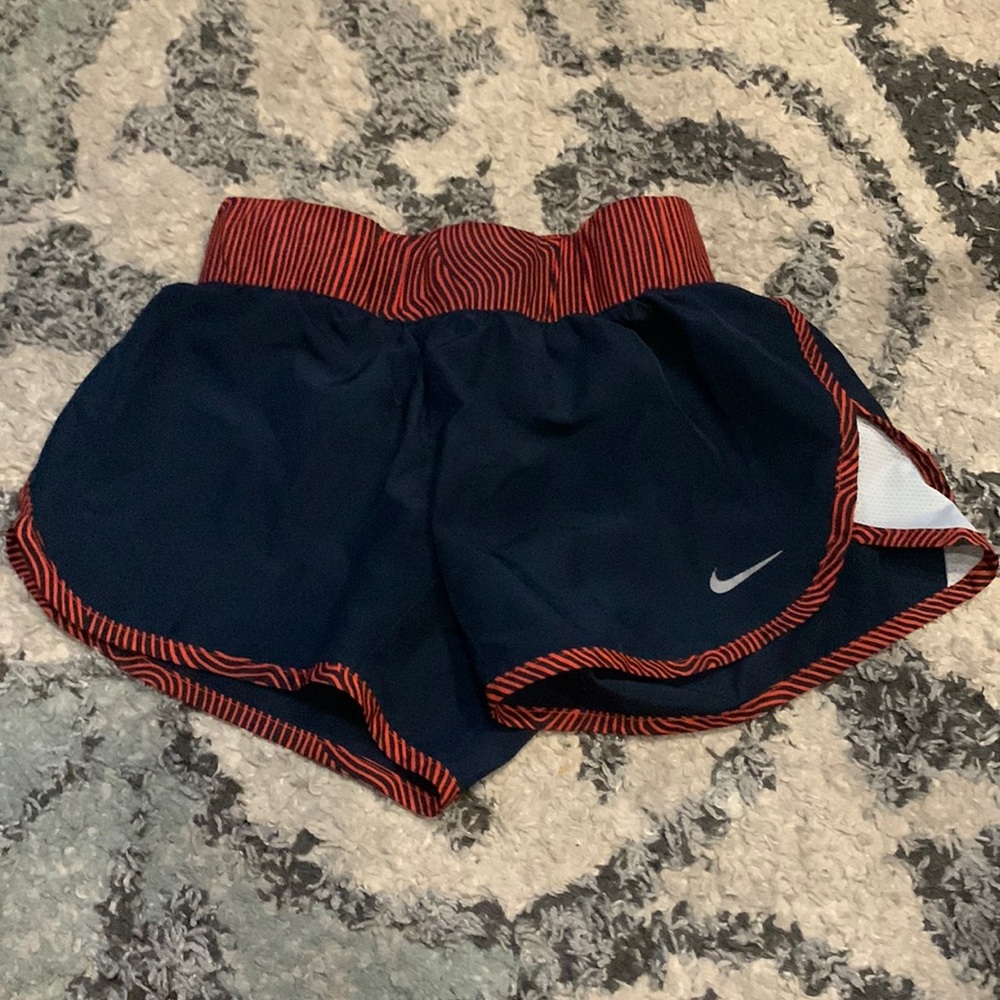 Kids red white and blue Nike shorts with mesh on side